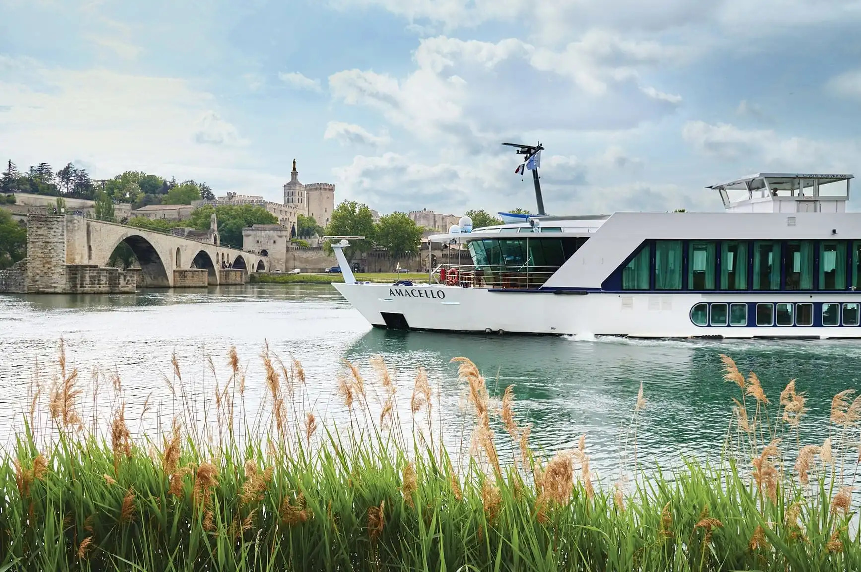 White river cruise ship near an old European city